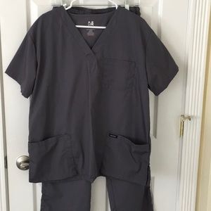 Dagacci scrub set in charcoal gray.  Never worn.